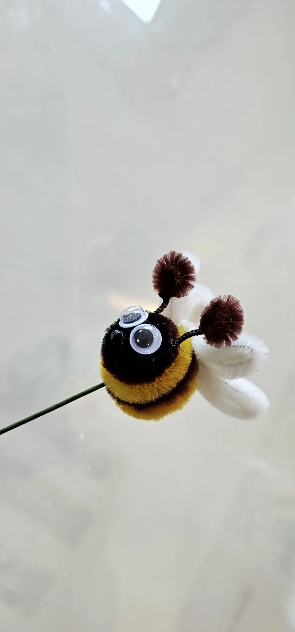 Close-up detail of handcrafted pipe cleaner bee