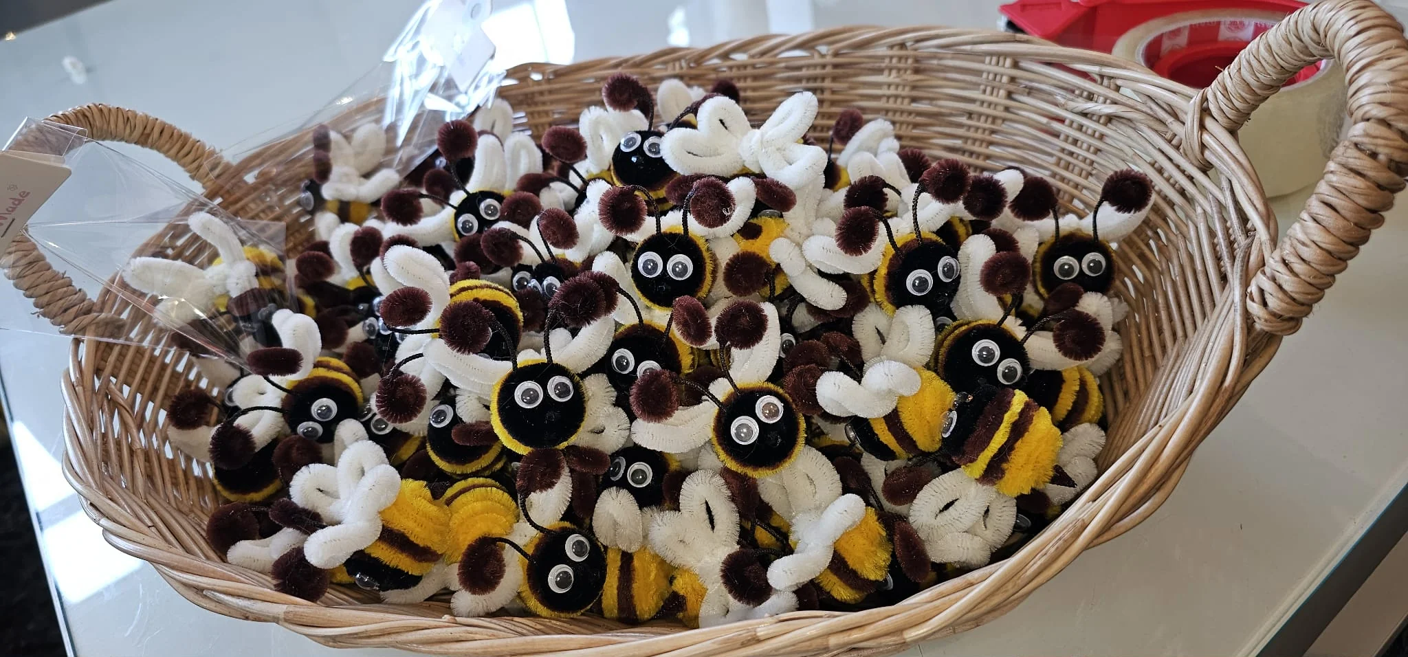 Basket of handmade pipe cleaner bees from Thailand bee conservation project