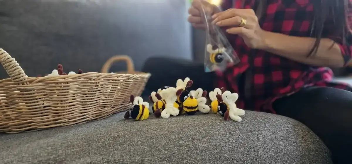 Artisan packaging handmade bees in cellophane with tags