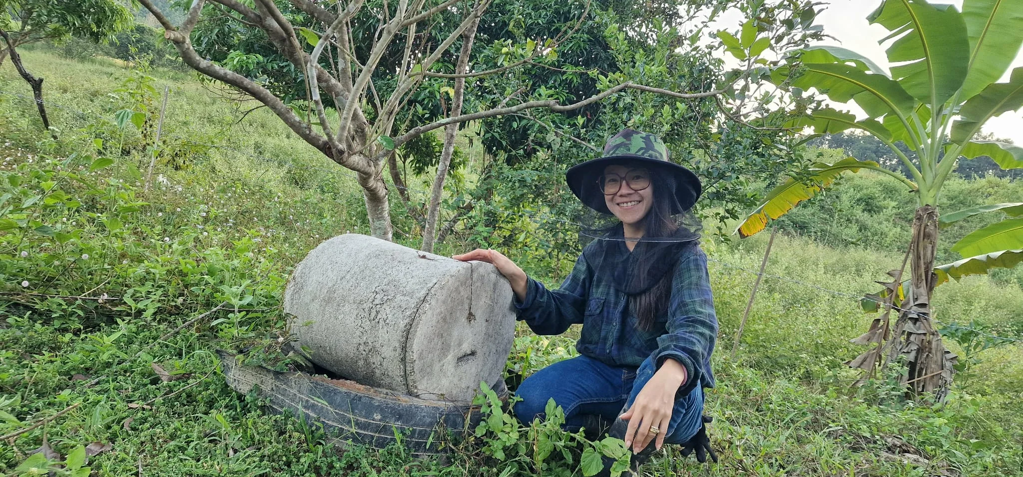 Nate inspecting and checking on a bee house